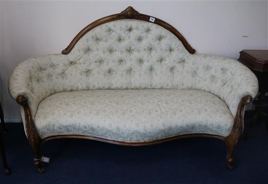 A Victorian carved walnut serpentine button back settee, W.180cm